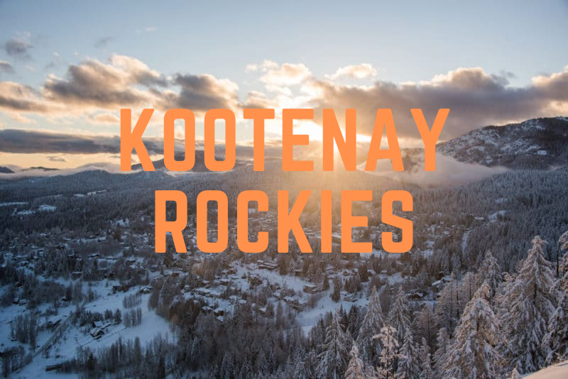 A snowy town and forest in the mountains at sunrise, with "KOOTENAY ROCKIES" in large orange text over the image, captures the stunning beauty of BC Mountain Resorts.