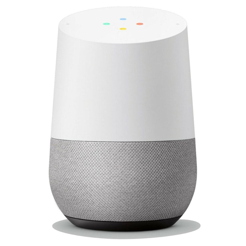 A white and gray smart speaker with a cylindrical design, mesh lower half, and four colored dots on the top surface—perfect for enhancing your Airbnb smart home experience.