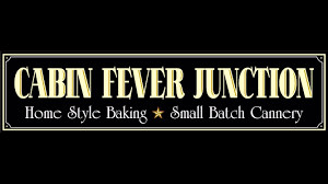 A rectangular sign with the text "CABIN FEVER JUNCTION" above "Home Style Baking ★ Small Batch Cannery" in light lettering on a black background, perfect for a Harrison Hot Springs wedding or local gatherings.