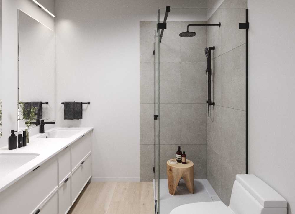 Modern bathroom at Cultus Grove with double sinks, black fixtures, a glass-enclosed shower, beige tiles, and a small wooden stool with toiletries. White cabinetry and light wood floor are visible.