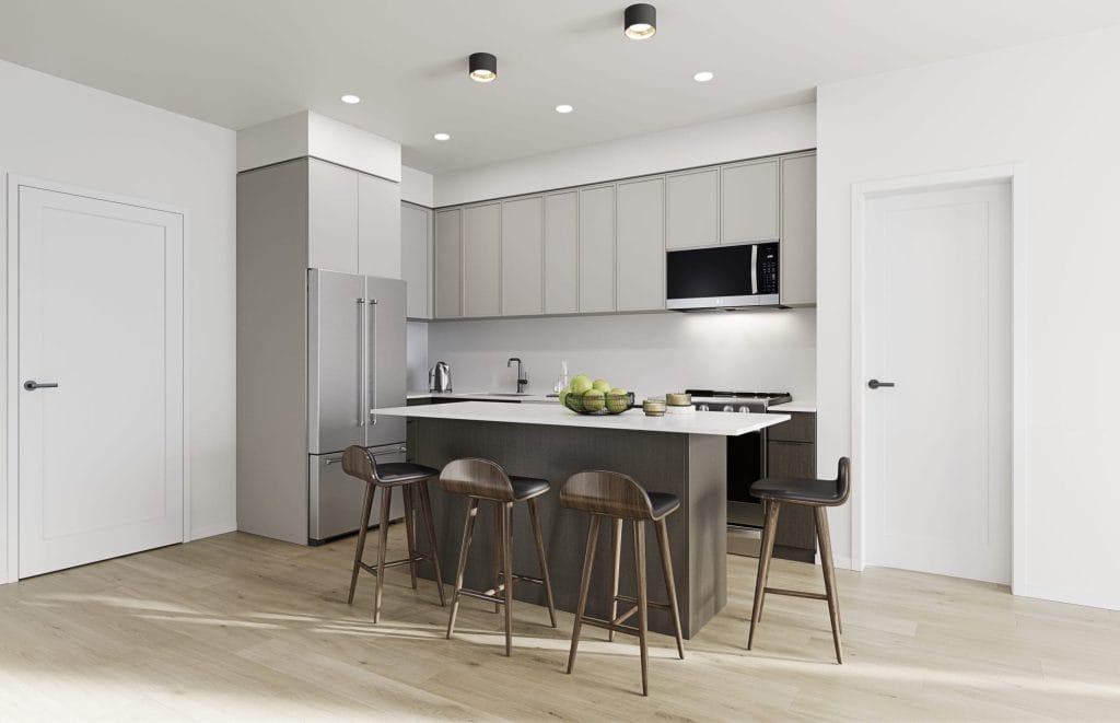 Modern kitchen in Cultus Grove with light gray cabinets, stainless steel appliances, island with four barstools, and light wood flooring. Two closed doors are visible on either side of the space.