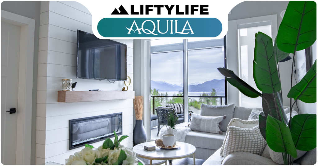 Modern living room with a wall-mounted TV, fireplace, large windows, gray sofa, indoor plant, and mountain view—an inviting retreat at Cultus Grove—under a banner that reads "LiftyLife Aquila.
